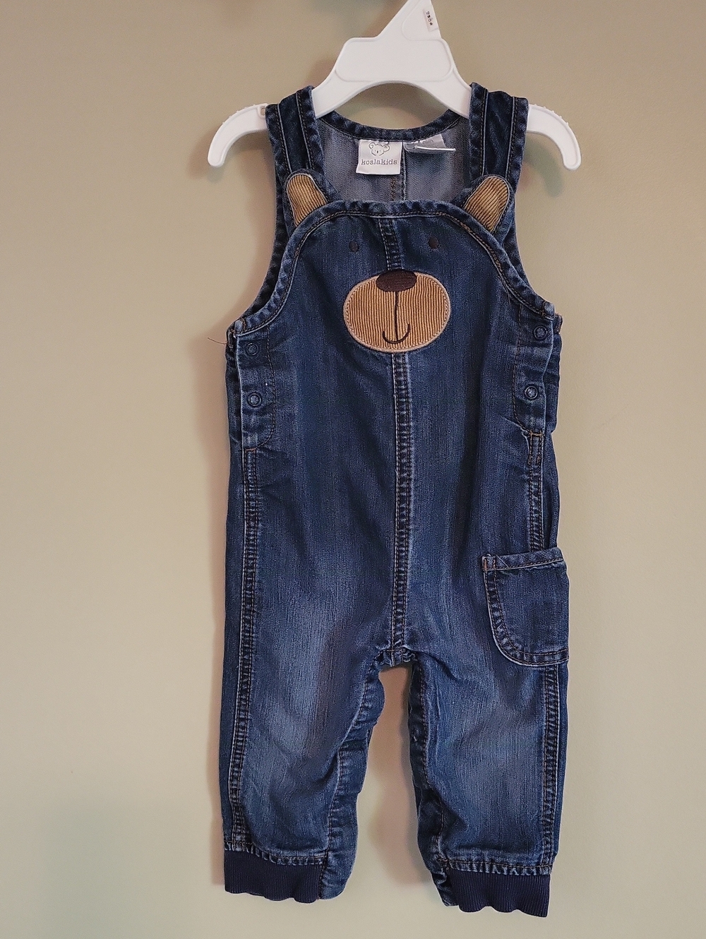 Adorable Koala Kids denim overalls with bear face applique.